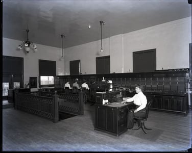 Women in room operating phone boards 2